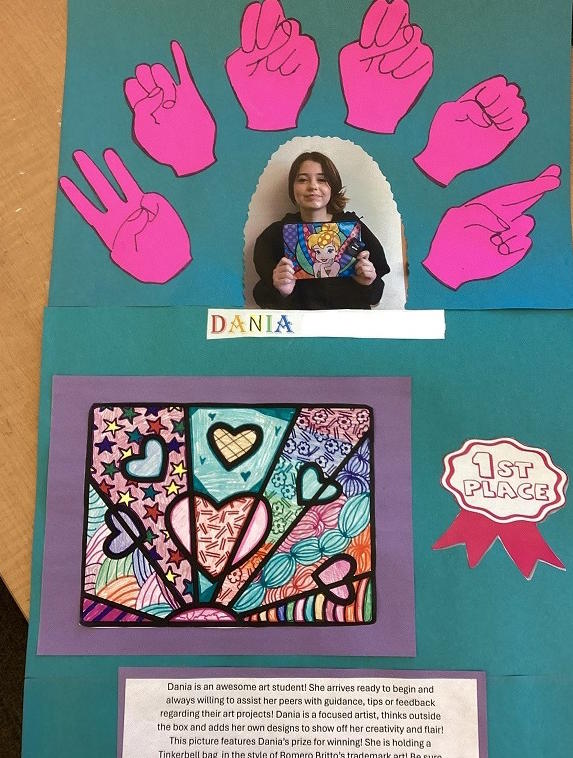 Dania holding her prize handbag, with ASL shapes "WINNER" and "Dania" around her picture. Lower section shows her artwork full of hearts, a 1st Place ribbon and text saying, "Dania is an awesome art student!"