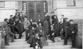 Teachers, in 1890, pose on the "Old Main" steps