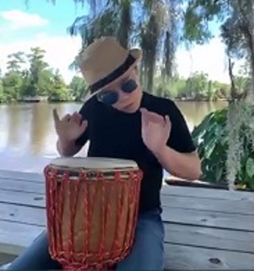 Student plays a unique drum