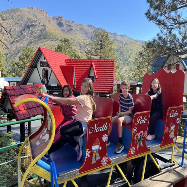 Four students ride a sleigh ride