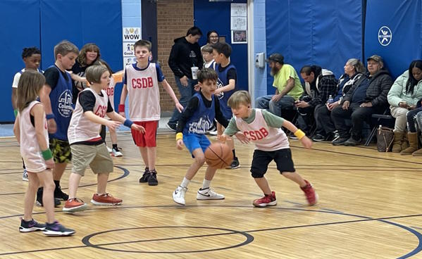 Students playing basketball