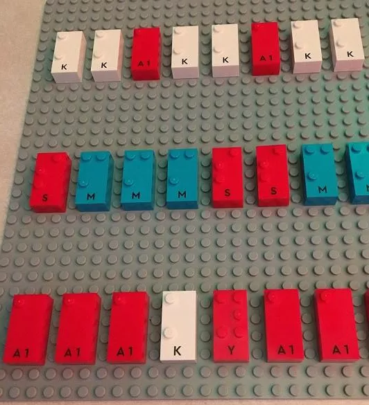 3 rows of lego braille bricks on a lego base