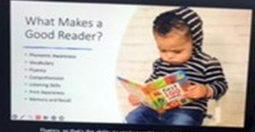 A boy wearing a hooded sweatshirt readilng a book.  What makes a good reader?
