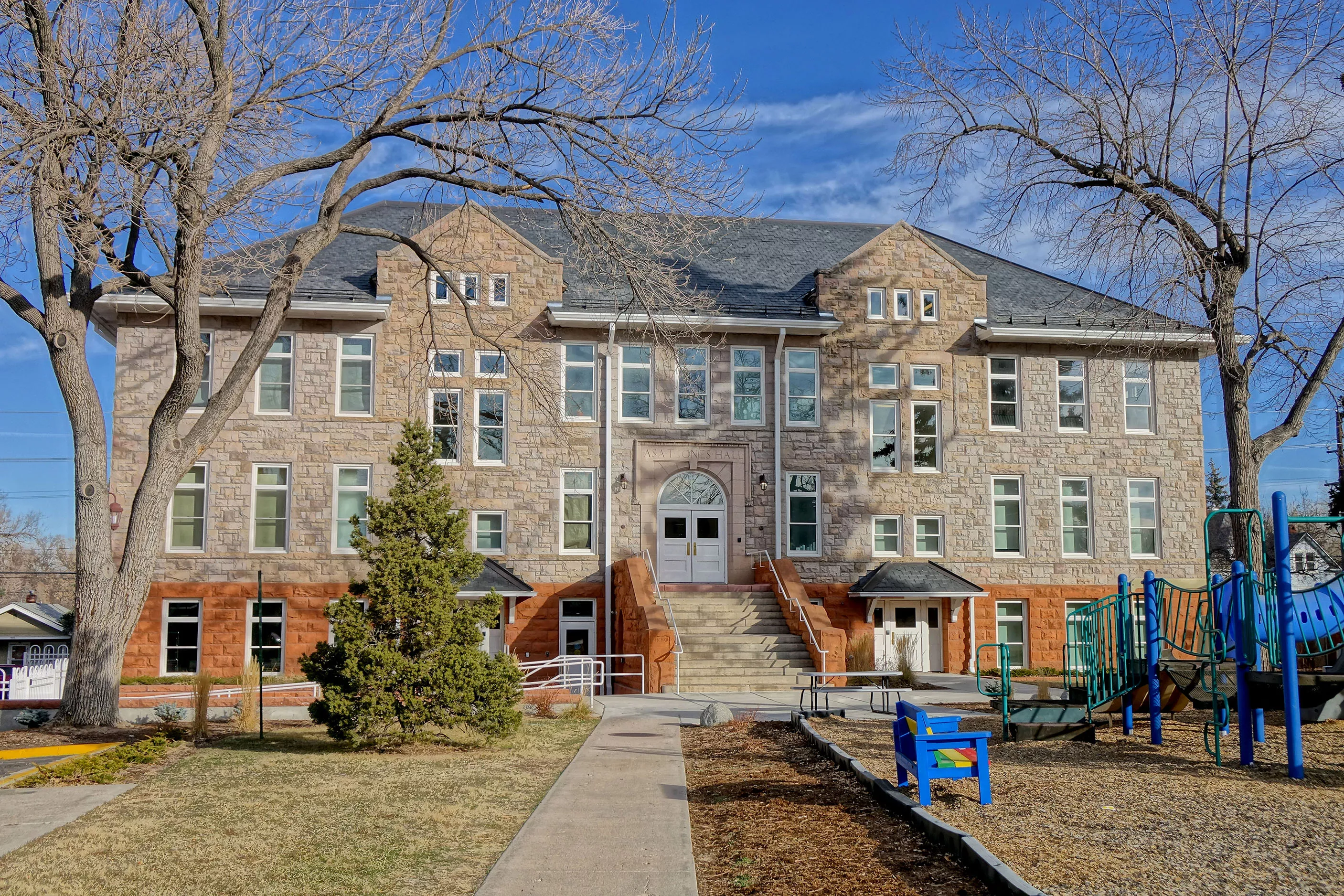 external view of the South side of the Jones Hall building with a playground in the right foreground.