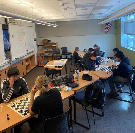 Four games of chess played concurrently in the classroom