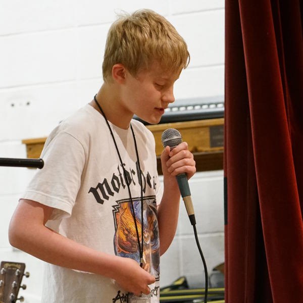 Student holds a microphone 