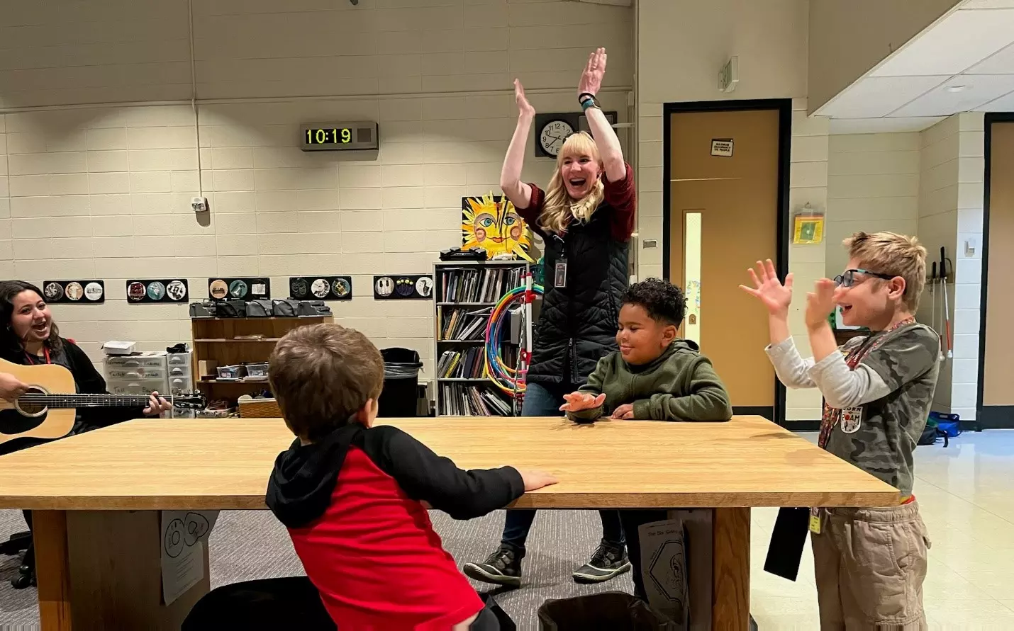 The Orientation and Mobility Specialist, Robin Teuting co-treats with the music therapy intern as her student understands one of their lesson objectives.  
