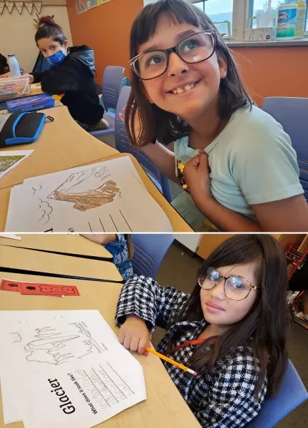  top young girl colors a landform drawing; lower photo another young girl writes about a glacier
