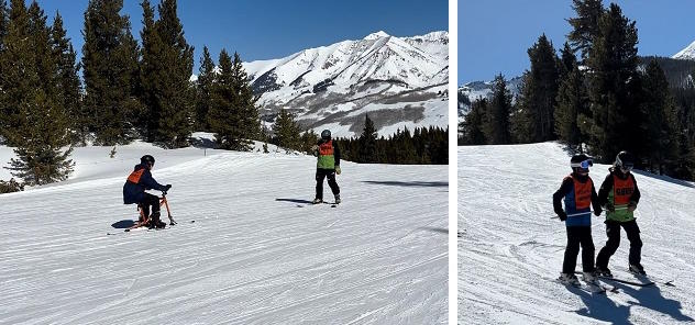 Student on a ski bike and student & guide skiing downhill;