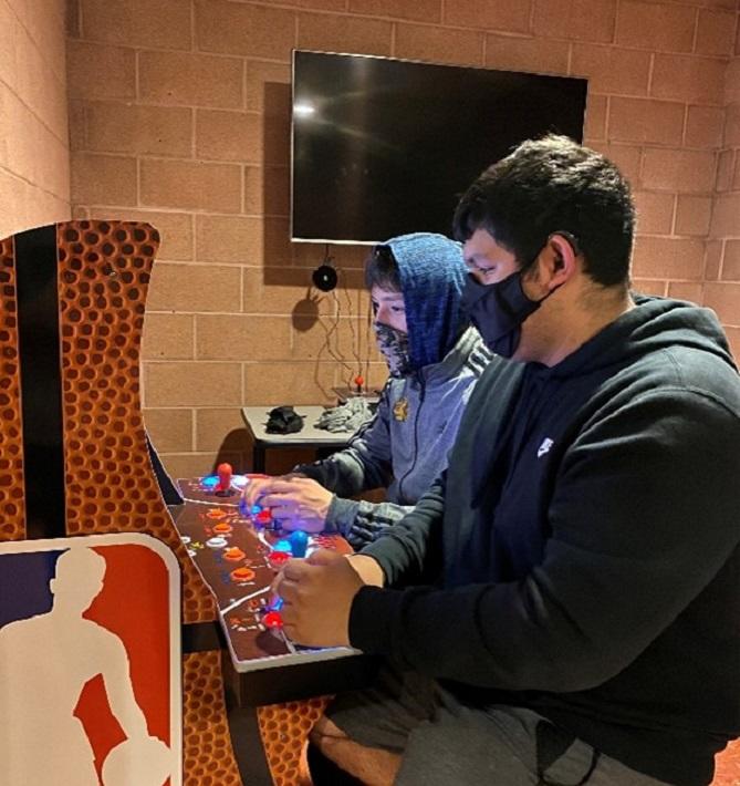 Two students playing video games