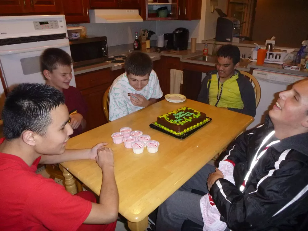 Students in blind dorms celebrating a birthday