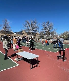 groups play games on the tennis courts