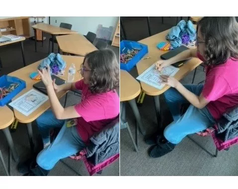 Student uses math manipulatives to work on a math sheet