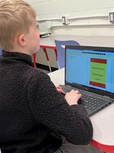 boy uses computer and JAWS
