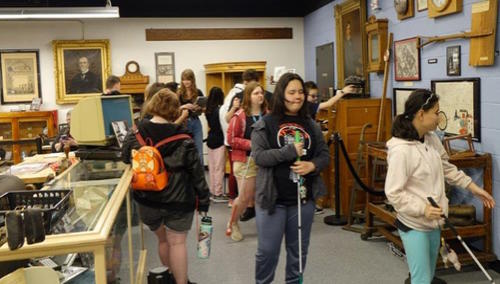 a group of student explore the history musuem