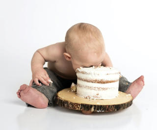 baby eating cake