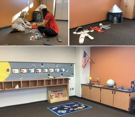  top left, student in an astronaut costume works on the floor with a teacher in a space helmet; top right, costumes and play space capsule displayed in the room; lower, far photo of the room with planet photos and models, space rug, cubbies and full book rack.]