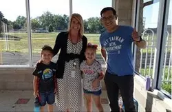 Interim Superintendent Tera Wilkins, 2 students and a teacher