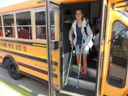 Student exiting school bus