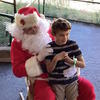 Student posing with Santa