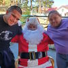 Two students pose with Santa